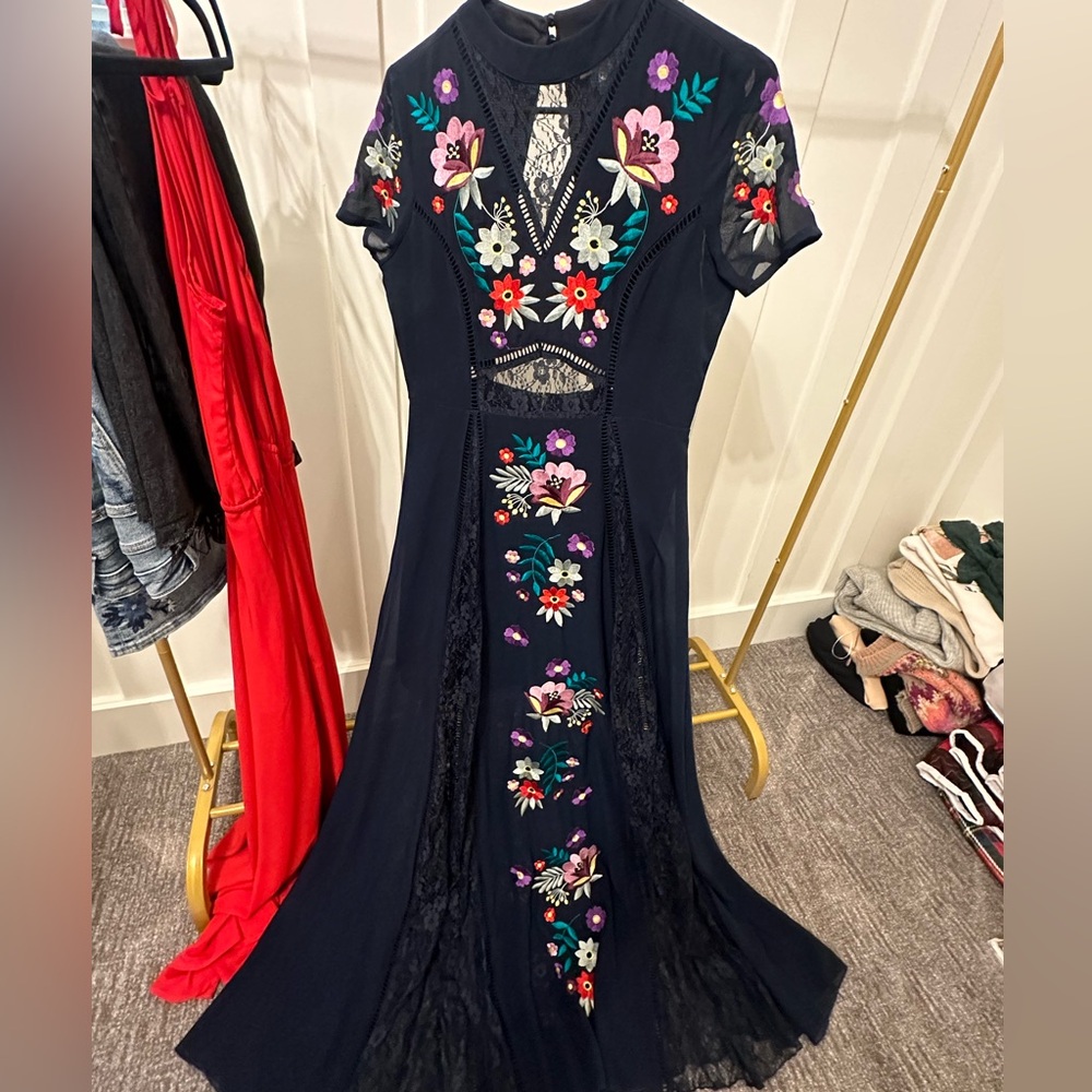 Beautiful Dress with floral details size 8 sheer sleeves cutout back navy blue